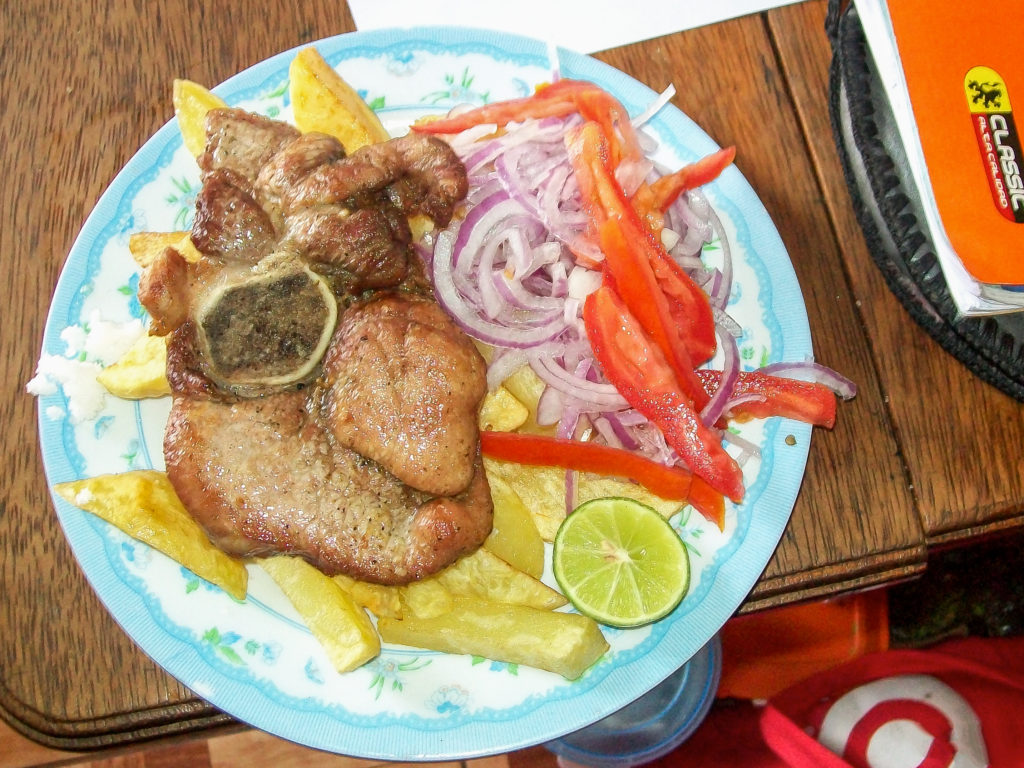 A delicious plate of pork and papas fritas 