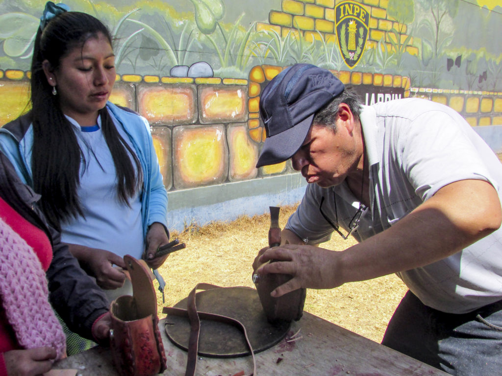 Senor Alberto demonstrates hammering techniques  