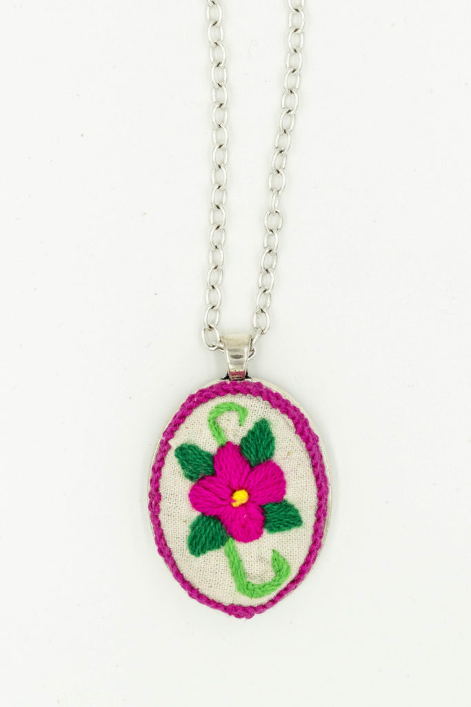 Embroidered pendant by Lucila 