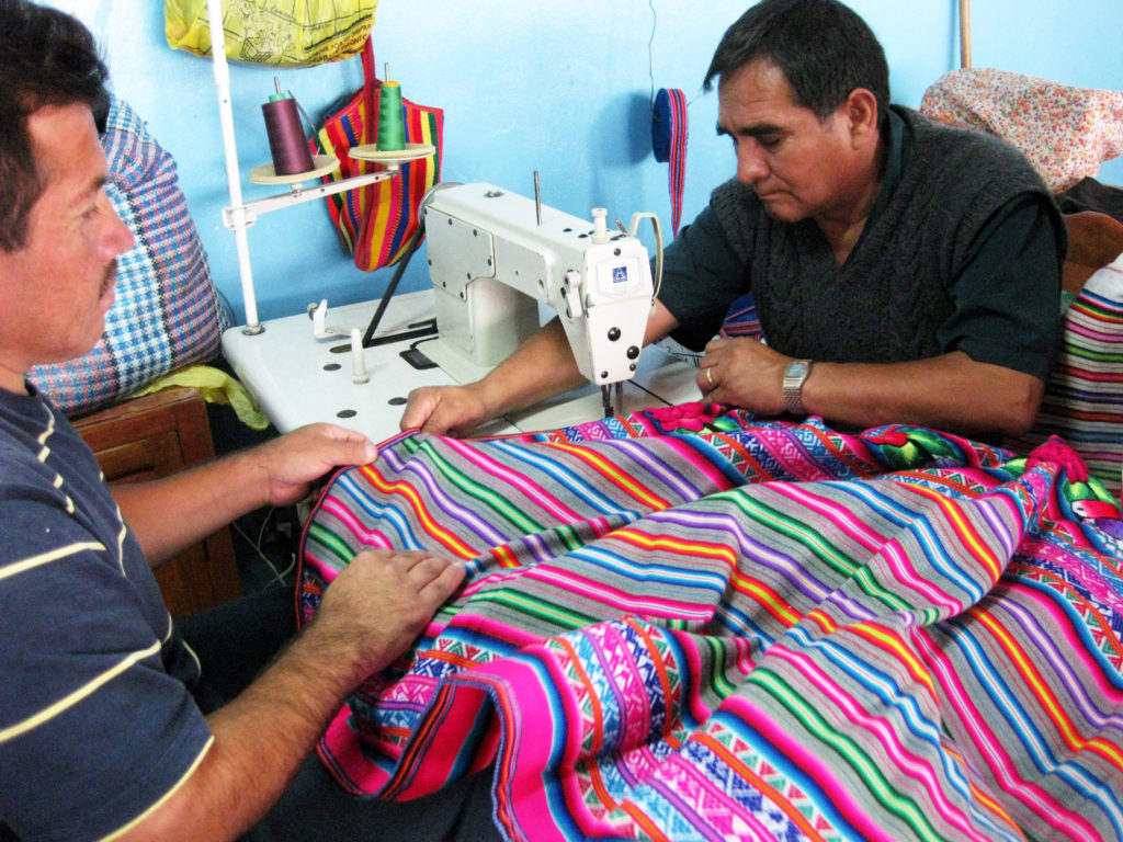 Men Sewing Manta